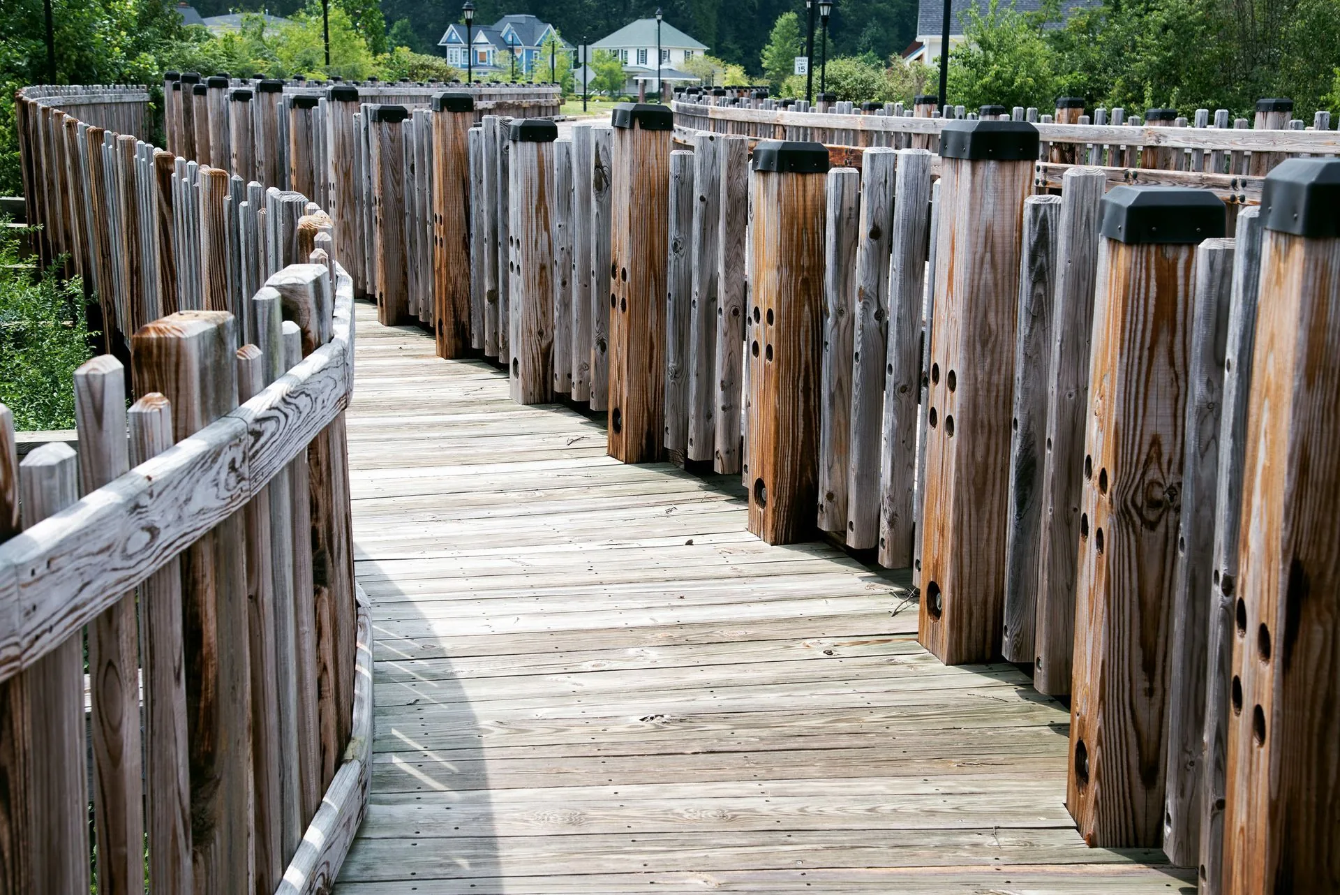 A wooden boardwalk winding through wooded parkland near Morrow, GA
